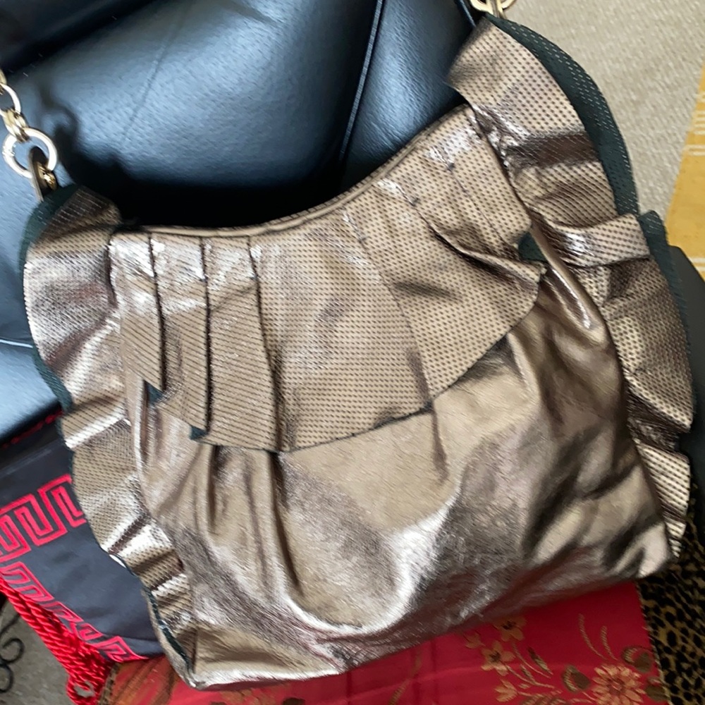 Alessandro Dell’ Acqua frilly bag in a bright gold